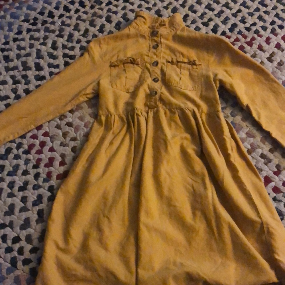 I am selling a orangish-brown dress. It is unbottonable and soft. It is worn